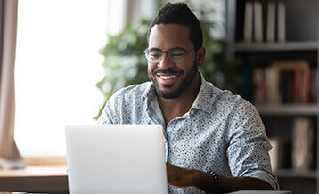 Happy Man on Laptop