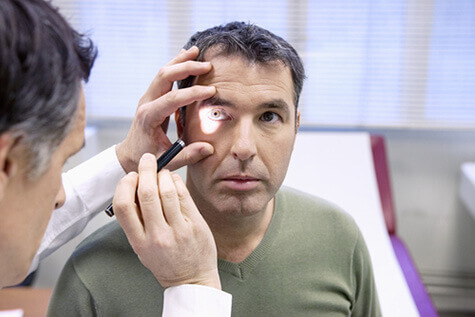 Man having eye examined