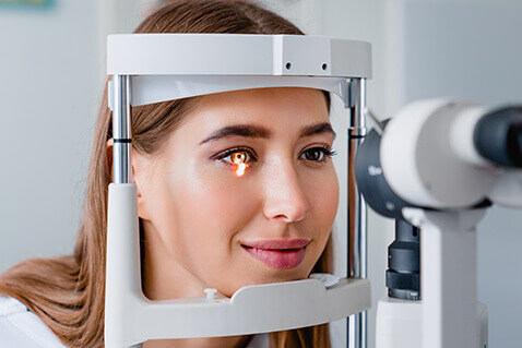 Woman having eye exam